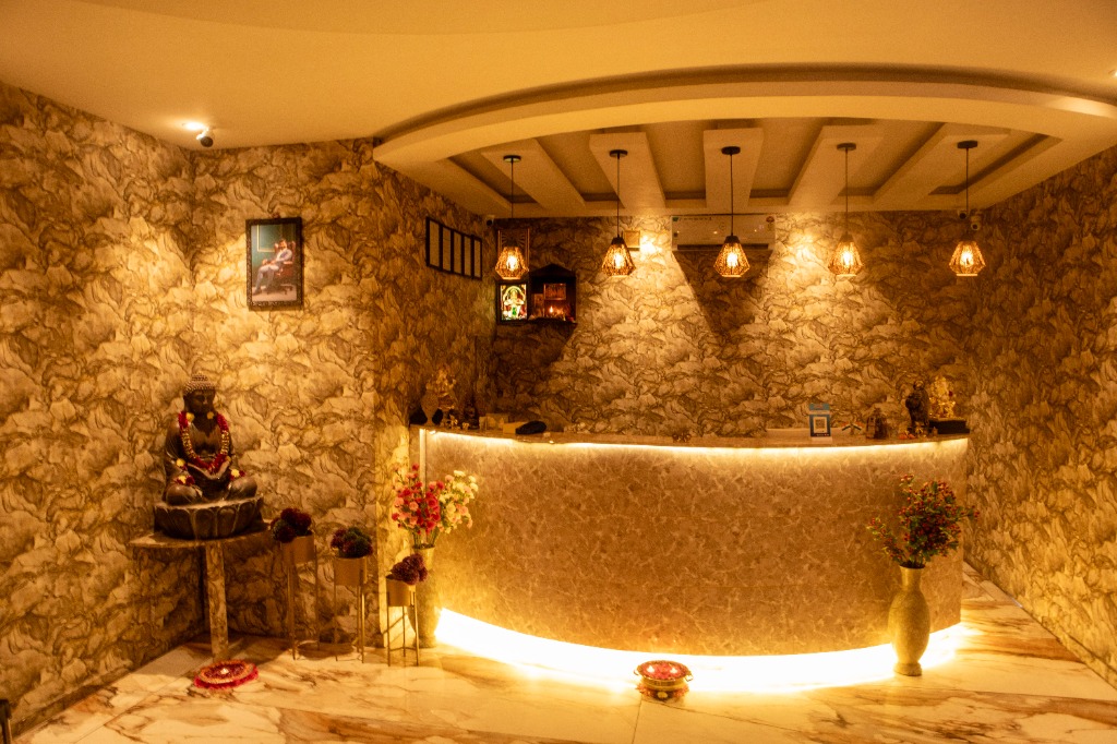 Reception lounge at Namaste Wellness & Spa with golden lighting